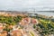 Aerial shot of colorful Lisbon city center, famous Comercio Square, River Tagus and green parks
