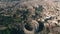 Aerial shot of Colosseum or Coliseum amphitheatre within cityscape of Rome, Italy