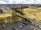 Aerial shot of country town cars, parking lot, green area, main street in Armidale, Australia