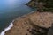 Aerial shot of the crowded La Nora beach in Asturias, Spain