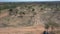 Aerial shot of dirt road diverging in two directions