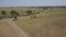 Aerial shot of dirt road diverging in two directions