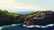 Aerial shot, drone point of view picturesque landscape, volcanic rocky mountains and Atlantic Ocean View at sunny summer day. San