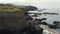 Aerial shot, drone point of view picturesque landscape, volcanic rocky mountains and Atlantic Ocean View at sunny summer day. San