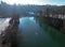 Aerial shot with drone of stand up paddler on river in winter