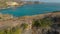 Aerial shot of the the family visiting the Broken Beach famous tourist place on the Nusa Penida island, Indonesia