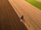 Aerial shot of a farmer plowing stubble field