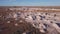 aerial shot flying over opal mine tailings at coober pedy on a winter afternoon