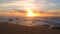 Aerial shot flying quickly backwards over beach at sunset