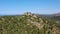 Aerial shot flying towards cliffs on top of mountain in Peguera, Mallorca, Spain