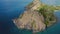 Aerial shot of a Fort Rodney on a mountain with trees in the sea from all sides at Rodney Bay, Saint Lucia