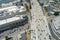 aerial shot freeway with cars and trucks driving with the Los Angeles Convention Center, office buildings, apartments