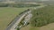 Aerial shot of freeway in fields with truck parking