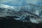 Aerial shot of frozen mountains covered with snow