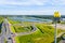 An aerial shot of the Golden Arches of McDonalds. Close to highway