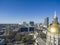 Aerial shot of the golden dome of Georgia Capitol Museum surrounded by office buildings and cars driving on the street