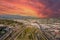 Aerial shot gorgeous autumn landscape at Los Angeles State Historic Park surrounded by streets with cars driving