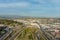 Aerial shot gorgeous autumn landscape at Los Angeles State Historic Park surrounded by streets with cars driving