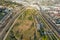 Aerial shot gorgeous autumn landscape at Los Angeles State Historic Park surrounded by streets with cars driving