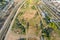 Aerial shot gorgeous autumn landscape at Los Angeles State Historic Park surrounded by streets with cars driving