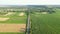 Aerial shot of green fields. Village agricultural farm fields drone shot view from above