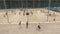 Aerial shot group of sportive people playing basketball at beach playground