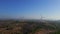 Aerial shot of a group of wind turbines in a semidesert environment. Green energy concept