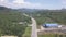 Aerial Shot of Highway Overlooking Scenic Mountains View