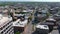 aerial shot of hotels, office buildings and apartments in the city skyline and vast miles of lush green trees and grass