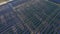 Aerial shot of a huge solar power plant in a big field. Electricity generation from solar energy. Green energy and zero