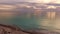 Aerial shot, incredibly beautiful calm sea in the sunset light with lots of clouds