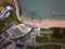 Aerial shot of industrial buildings near the sea in Bowleaze Cove, Weymouth, Dorset