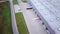 Aerial Shot of Industrial Warehouse/ Storage Building/ Loading Area where Many Trucks Are Loading/ Unloading Merchandise