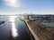 Aerial shot of a line of cargo train cars in the North Vancouver trainyard.