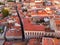 Aerial shot of the Lisbon buildings with tops of red roofs in Alfama, Portugal.