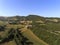 Aerial shot of a little village surrounded by nature of Monti Sibillini National Park , Collevecchio, Macerata, Italy