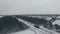 Aerial shot lonely train on railway in winter