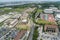 aerial shot of the Louisiana State University campus and the Mississippi River with cars on the street and lush green trees