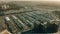 Aerial shot of a major wholesale commercial centre full of trailer trucks loading at warehouse bays