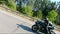 Aerial shot of man riding fast on modern sport motorbike at highway during summer day. Motorcyclist racing his