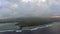 Aerial shot of Mauritius with low clouds and blue lagoons