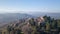 Aerial shot of the medieval village of Montemaggiore al Metauro with a church and trees around