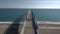 Aerial shot moving over pier on the Mediterranean sea