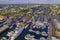 Aerial shot of the Newport Harbor in Rhode Island with ducked boats and a landscape