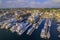 Aerial shot of the Newport Harbor in Rhode Island with ducked boats and a landscape