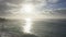 Aerial shot on Oahu Hawaii Island. Drone flies on a sandy beach. View of the rocky mountains. Early morning on a