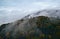 Aerial shot of an old lookout tower in the foggy forest in Eberbach, Odenwald, Germany