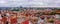 Aerial shot of the old town of Tallinn with orange roofs, churches\' spires and narrow streets