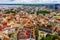 Aerial shot of the old town of Tallinn with orange roofs, churches\' spires and narrow streets