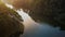 Aerial shot over a lake with bamboo boats and morning sunlight. Pang Oung Lake in Thailand